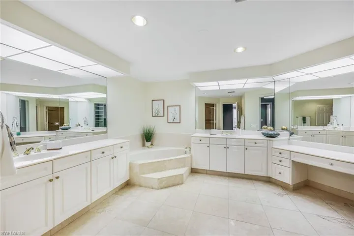 Primary bathroom has dual sinks, huge soaking tub, vanity and separate walk inshower.