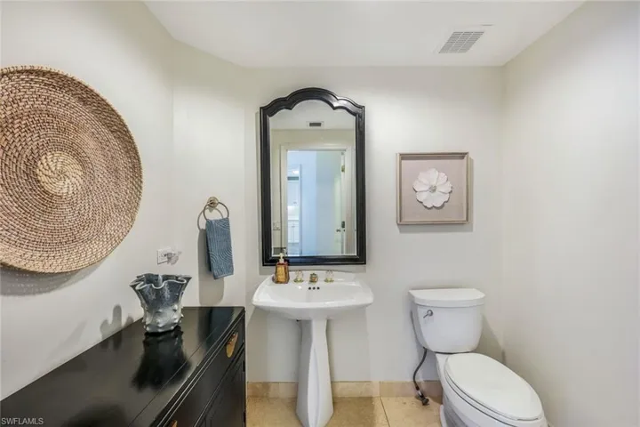 Convenient half bath situated near kitchen and great room.