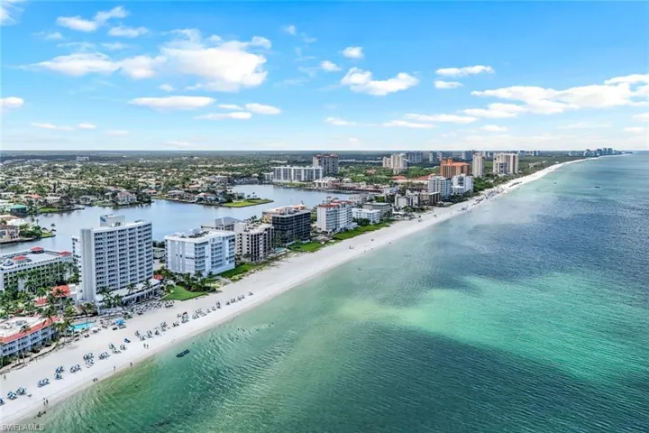 Drone / aerial view with a beach view and a water view