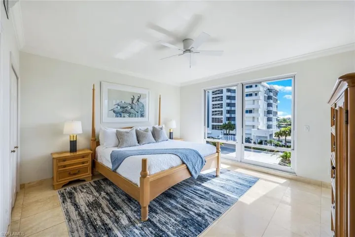 Second bedroom faces the bay, pool, and tennis court. Every window hasbeautiful views.
