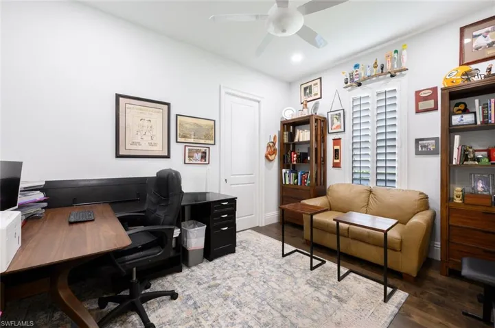 Office featuring wood-type flooring and ceiling fan