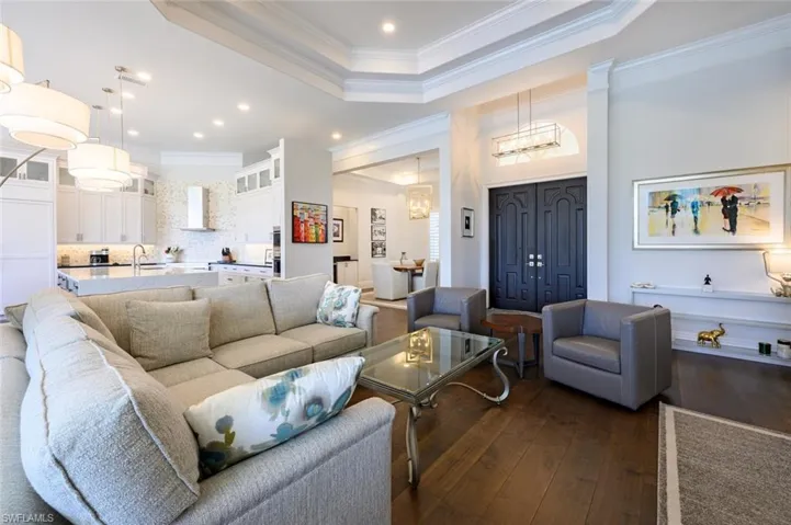 Gorgeous French front doors  to enter the home and the perfect room for relaxing .