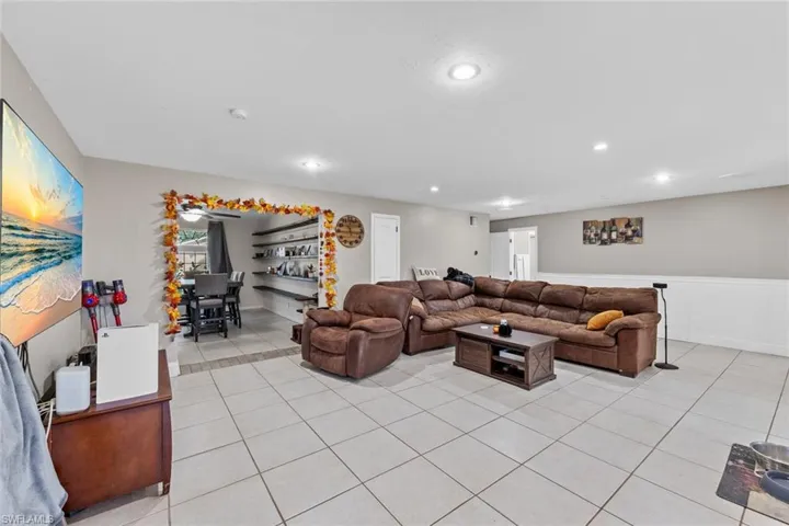 Living room with light tile patterned floors