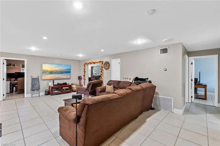 Living room with light tile patterned floors