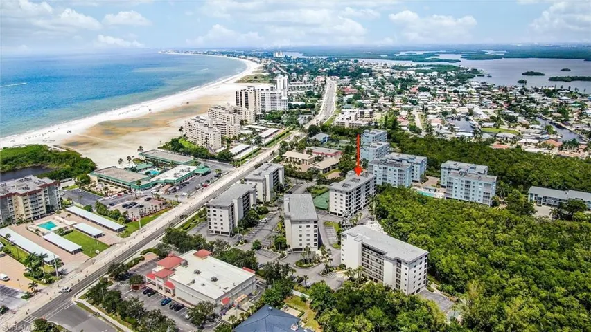 Bird's eye view with a view of the beach and a water view