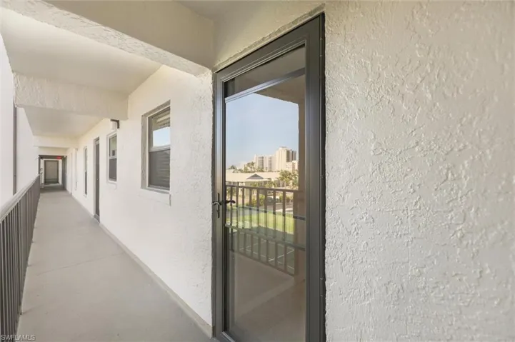 Corridor featuring plenty of natural light