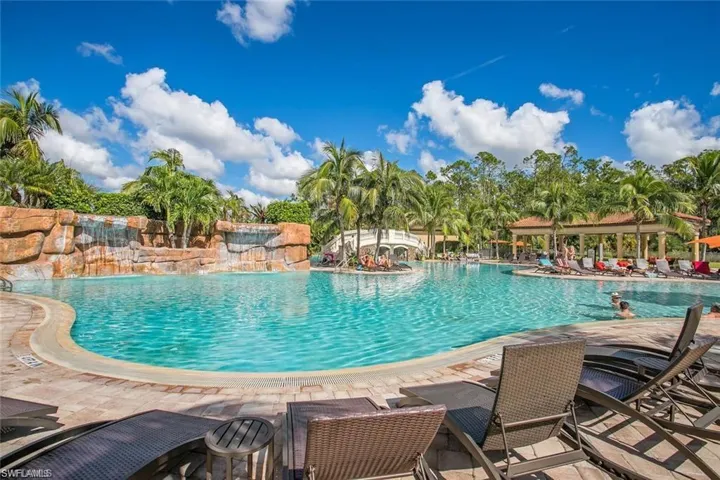 View of swimming pool with a patio and pool water feature