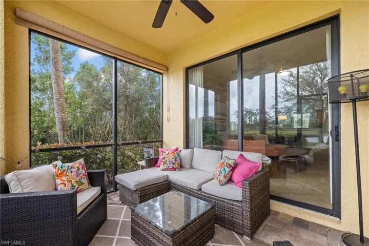 Sunroom / solarium featuring ceiling fan