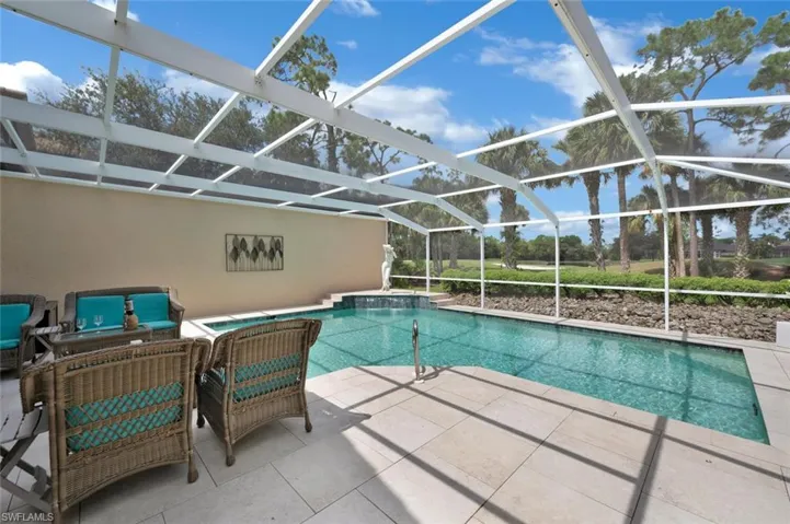 Screened in pool with golf course and lake view