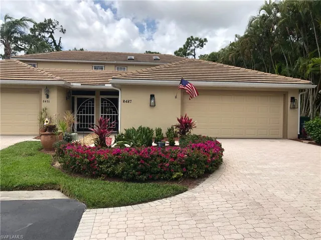 View of front facade featuring a garage