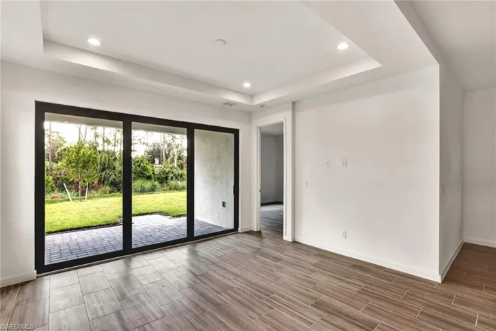 Great room with tray ceiling unfurnished