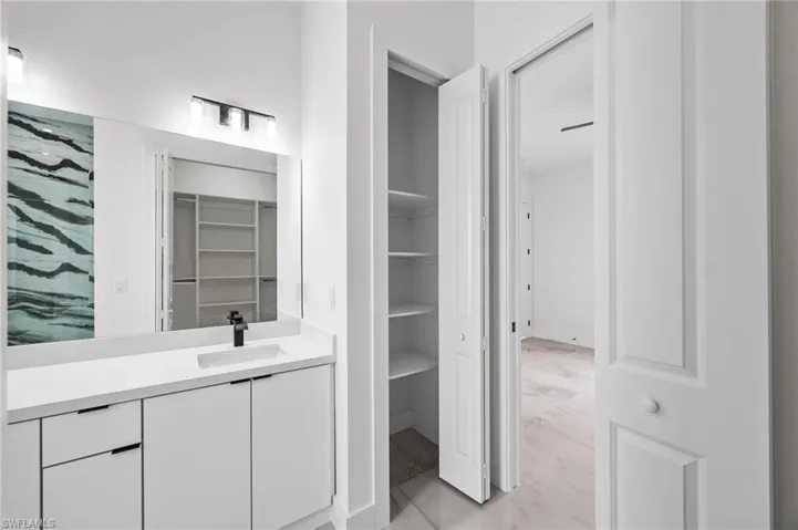 Bathroom featuring hardwood / wood-style floors and vanity