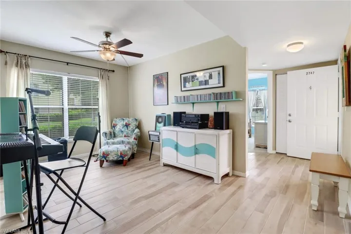 Office featuring ceiling fan and light wood-type flooring