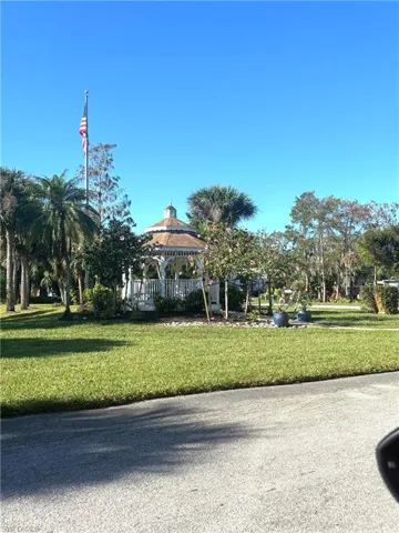View of home's community with a gazebo and a yard