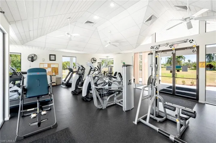 Exercise room featuring a ceiling fan