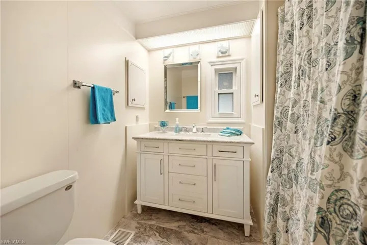 Bathroom featuring vanity and a shower with curtain