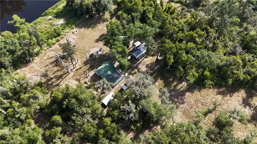 Aerial view of property's location featuring property parcel outlined and a large body of water