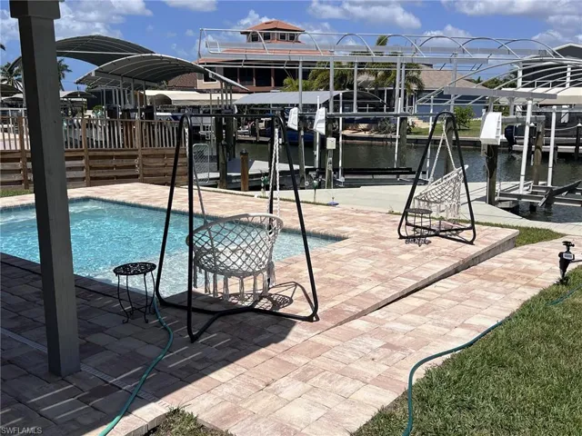 New pool in a fenced back yard.
