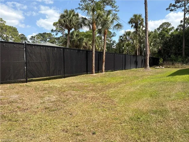 View of yard featuring fence