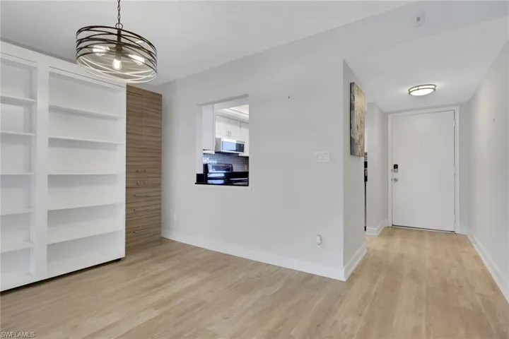 Entry way, kitchen and dining area