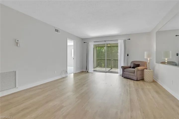 Living Area. The chair, table and lamp in this photo can stay or be removed.