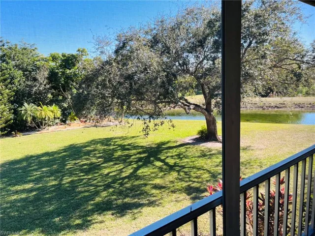 View from lanai of lake, golf course and landscaped area
