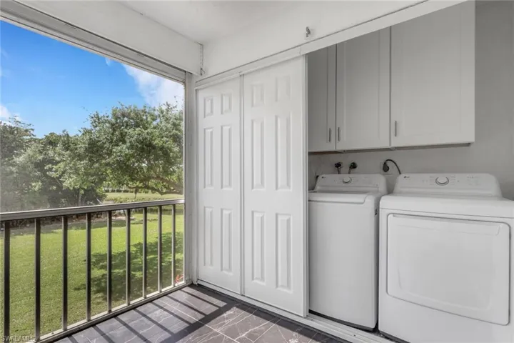 Laundry area featuring cabinet space and washer and dryer