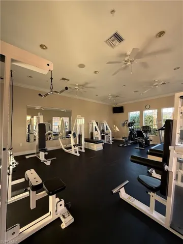 Workout area featuring crown molding, a ceiling fan, and recessed lighting