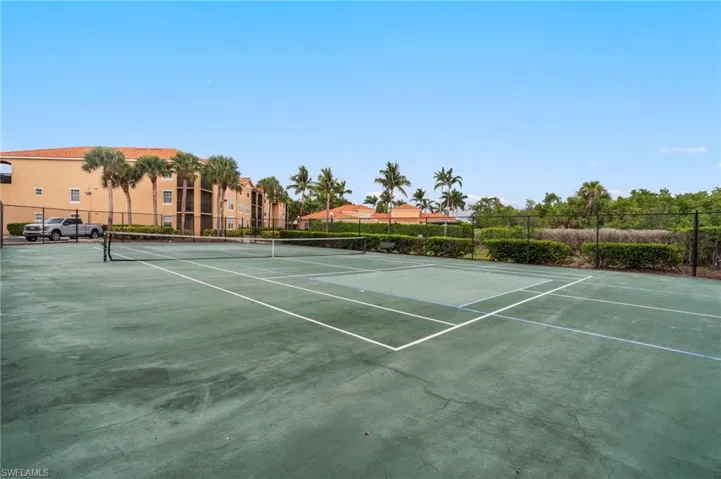 View of tennis court featuring community basketball court