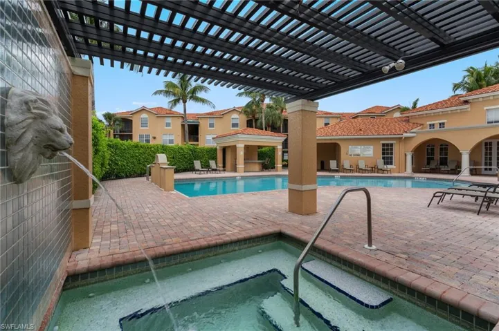 Community pool with a patio area, a community hot tub, a pergola, and a gazebo