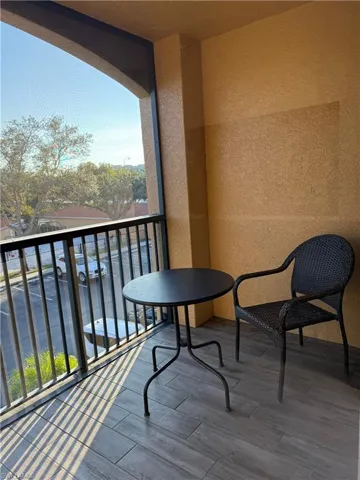 Balcony featuring a sunroom