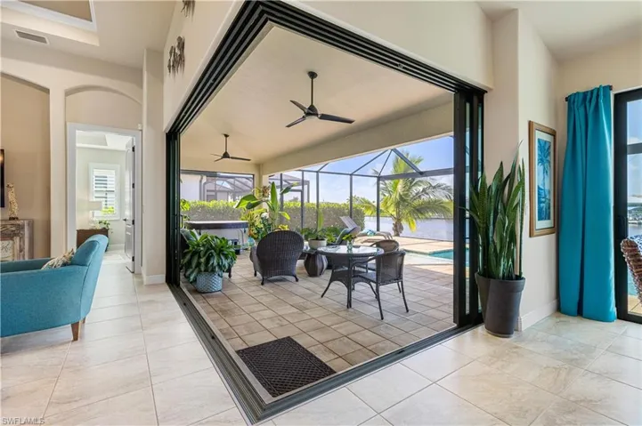 Dining area featuring ceiling fan and light tile patterned floors