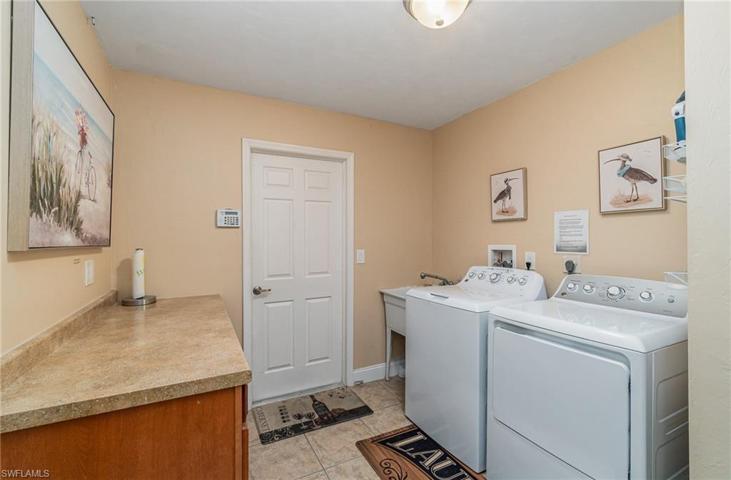 with folding area and laundry tub