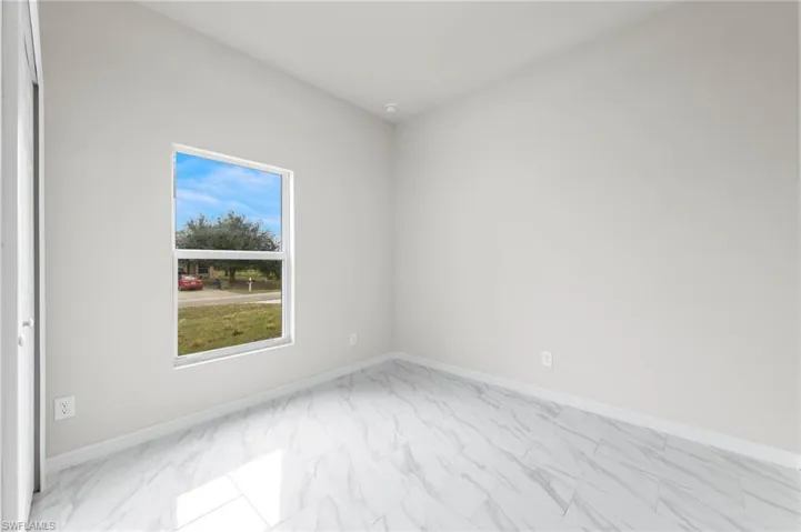 Bedroom 2 - patterned floors with large closet.