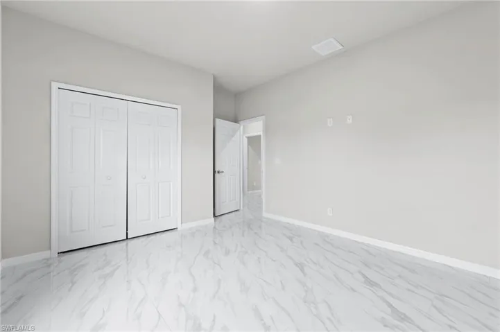 Bedroom 3 - patterned floors with large closet.