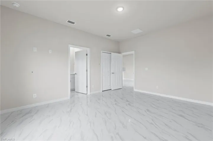 Spacious master bedroom with walk in closet.