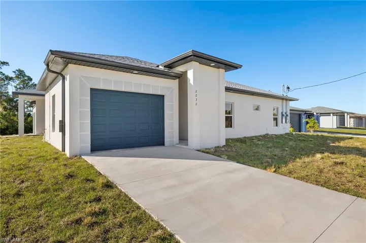 View from the street - all impact windows, sliders, exterior doors and garage door