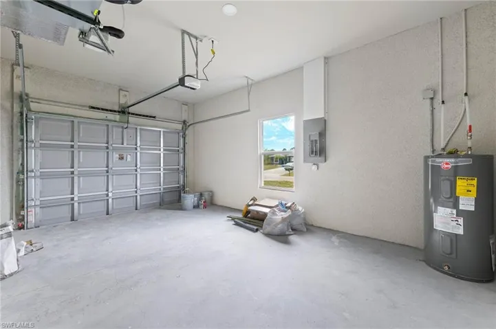 One car garage with large driveway for additional parking.