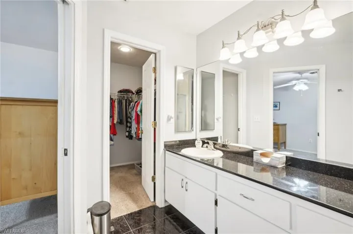 Bathroom featuring vanity and ceiling fan