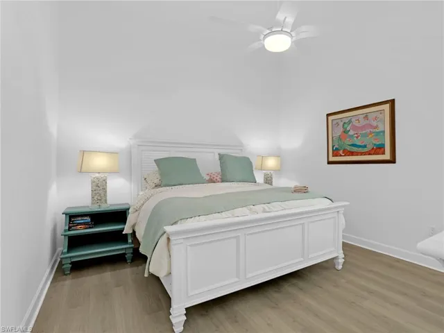 Bedroom with light wood-style flooring and ceiling fan