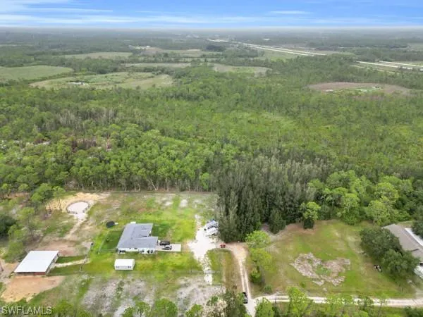 Aerial overview of property's location with a forest