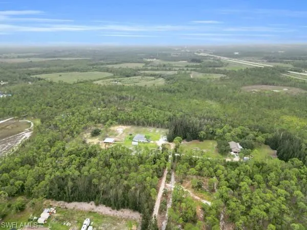 View of property location with a forest