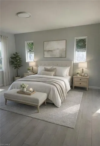Virtual Bedroom with hardwood / wood-style floors and baseboards