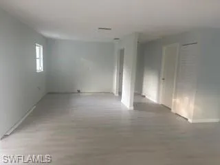 Empty room with wood finished floors