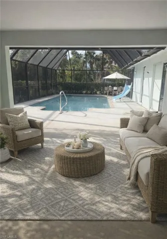 Virtual Staging Swimming pool with a lanai, a water slide, a patio area, and a sunroom