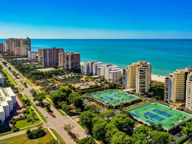 Bird's eye view with a water view and a view of the beach