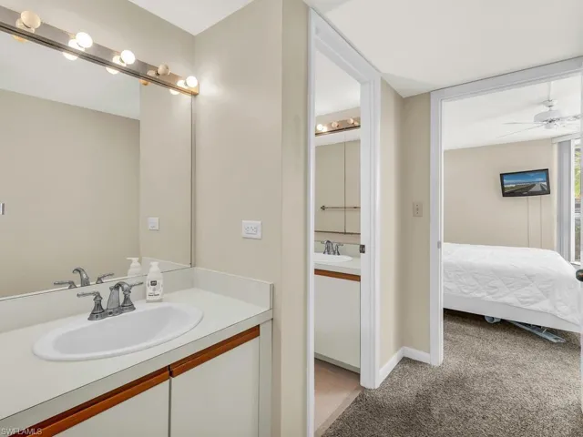 Bathroom featuring ceiling fan and vanity