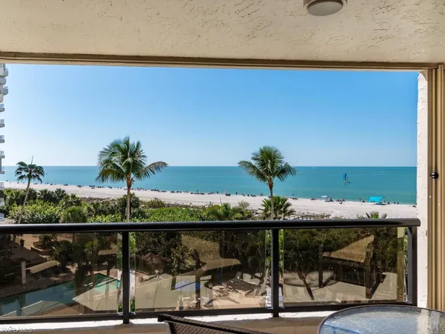Balcony with a view of the beach and a water view