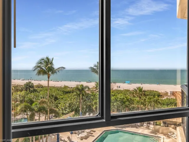 View of water feature featuring a beach view