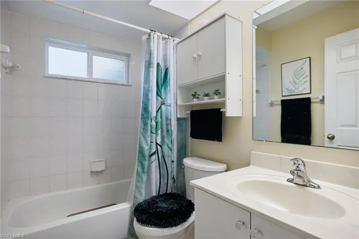 Full bathroom featuring vanity and shower / tub combo